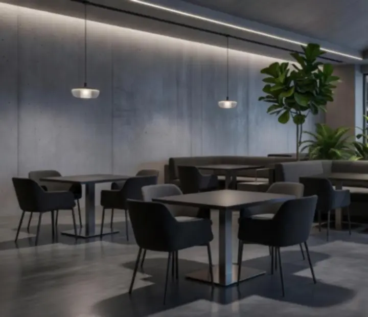 Interijer loft casino restorana s betonskim zidovima, visokim stropovima i industrijskom rasvjetom.